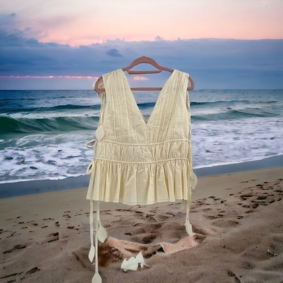 Tory Burch
Sleeveless Smocked Peplum Top COLOR New Ivory size 0 - Picture 13 of 17